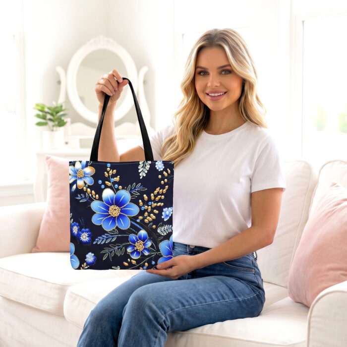The_women_is_sitting_on_202606192243 Floral Blue Gold Garden Canvas Tote Bag – Ornate Boho Design - Image 1